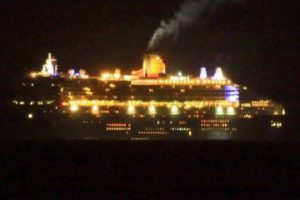 The Queen Mary viewed at night from the balcony of Capeview Apartments