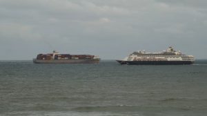 P&O's Pacific Aria about to pass a container ship viewed from the balcony of Capeview Apartments